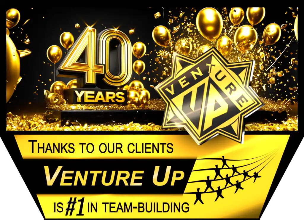 Venture Up celebrating 40 years of business with gold balloons and confetti, thanks to our clients, Venture Up is #1 in team-building.