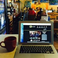 Laptop and Coffee at Coffee Shop