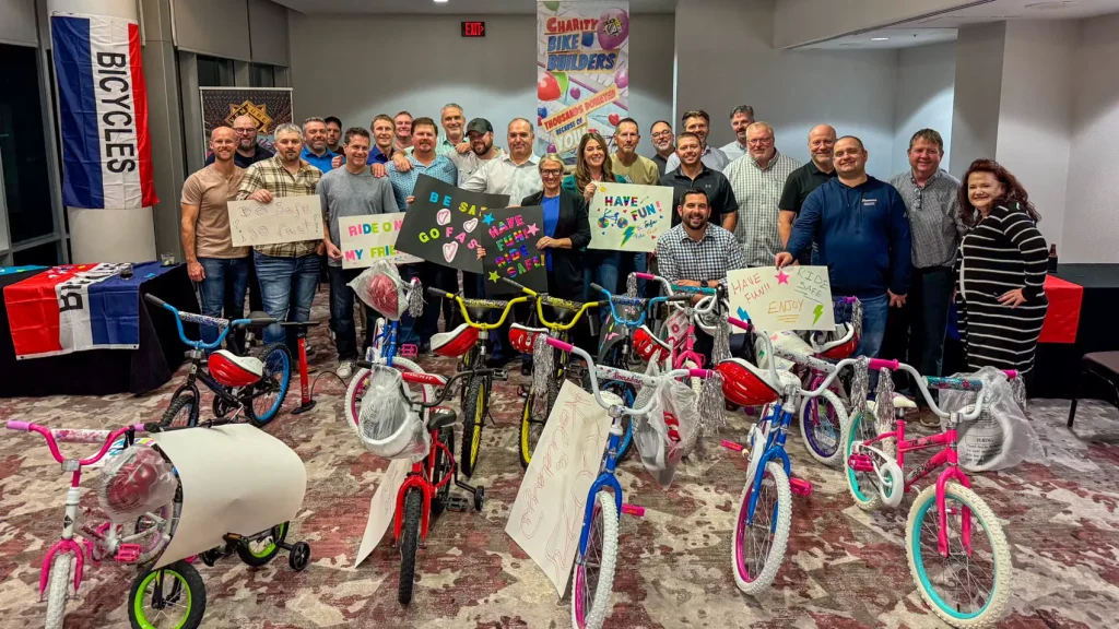 Corporate group with decorated bikes after Bike Building in Houston