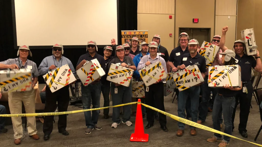 Team holding Escape Case briefcases in Houston, Texas