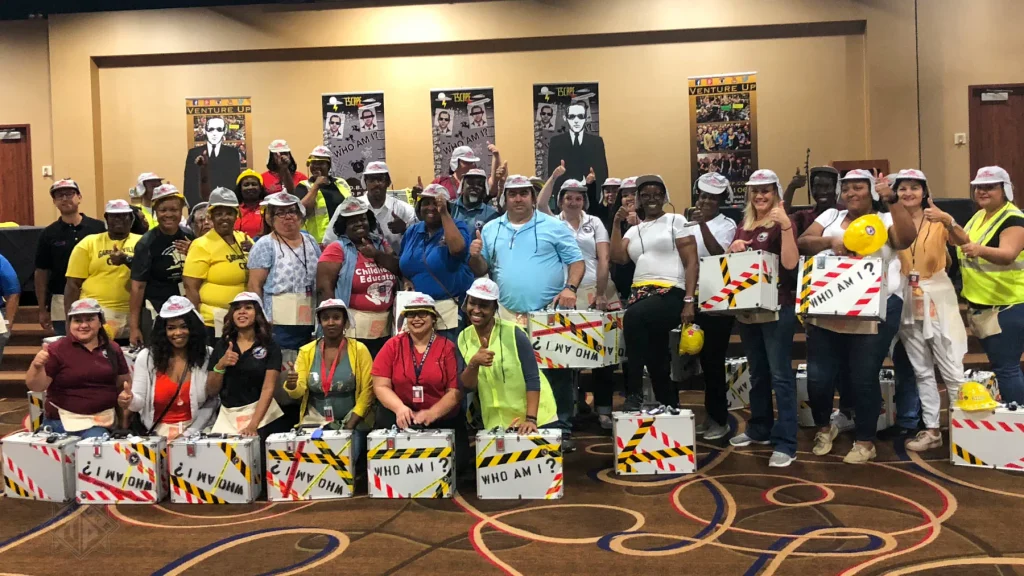Team posing with Escape Case briefcases and hard hats in Houston