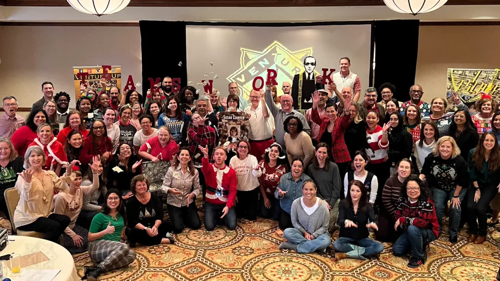 Large group celebrating Escape Case completion in Houston, Texas