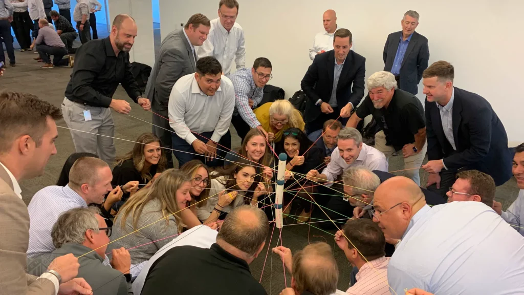 Team managing string challenge during Strategic Games in Houston