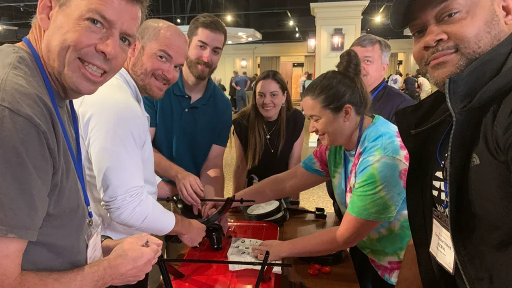 Team assembling red wagon during Wagon team building in Pinehurst