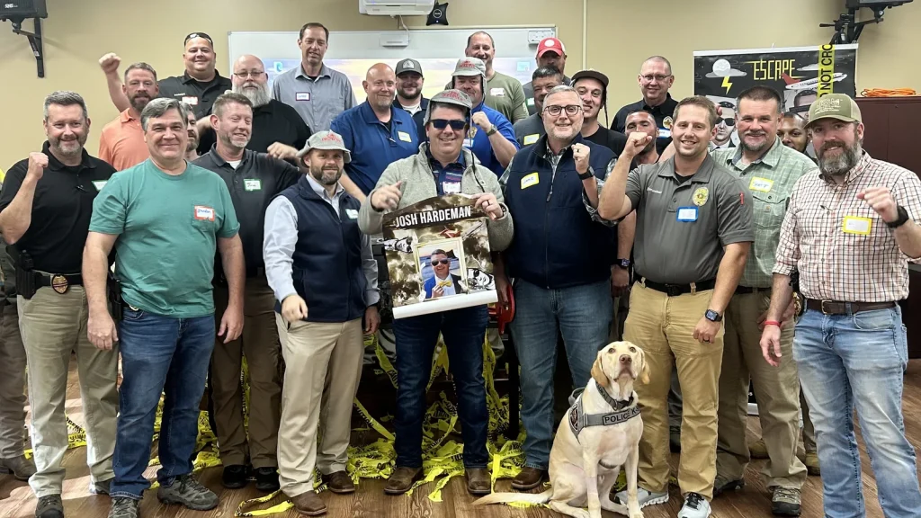 Team celebrates after completing Venture Up's Escape the Case team-building challenge.